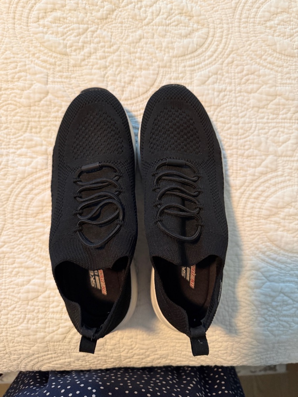 Skechers Women's Black Knit Slip-On Sneakers with White Sole